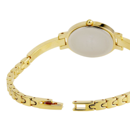 Montre dame, boite et bracelet en acier et acier doré, cristaux de synthèse et verre minéral