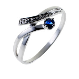 Bague en or gris et saphir