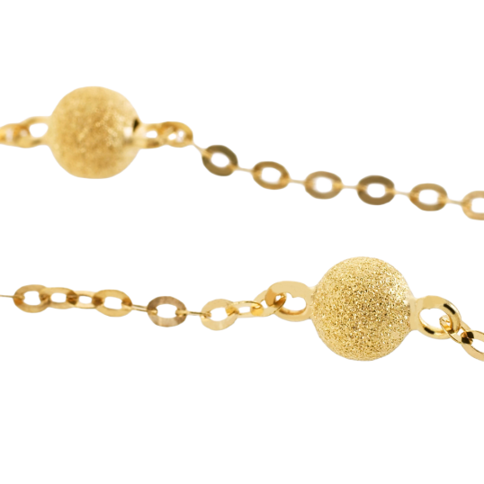 Bracelet en or jaune et boules granitées