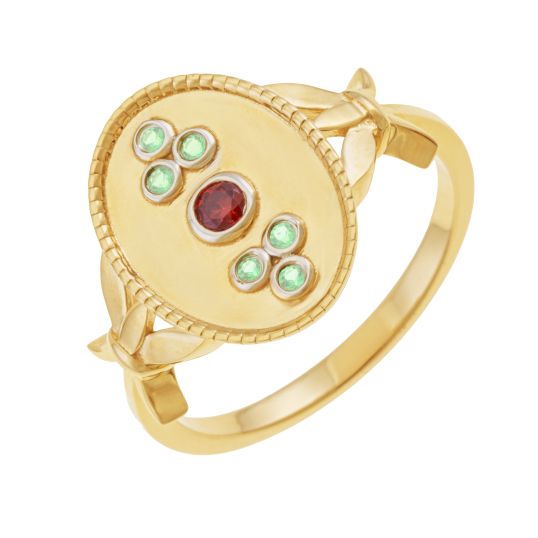 Bague en or jaune et rhodié, péridots et grenat, ovale